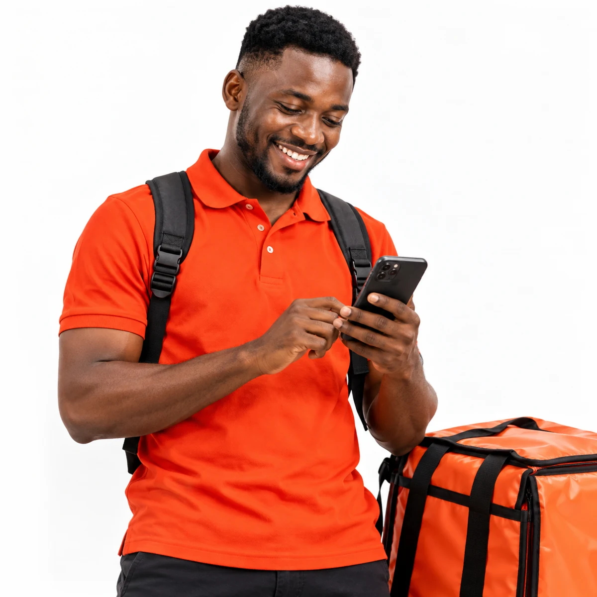 A smiling rider checks his phone beside an orange delivery bag